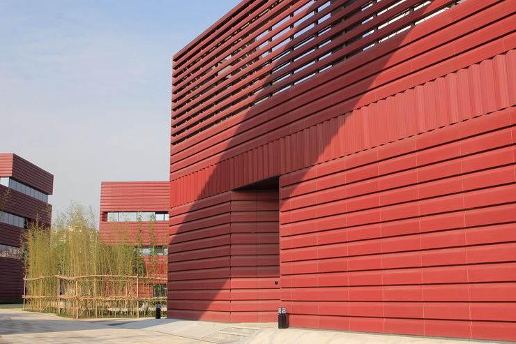 red glazed triangular and trapezoidal different-sided terracotta panel